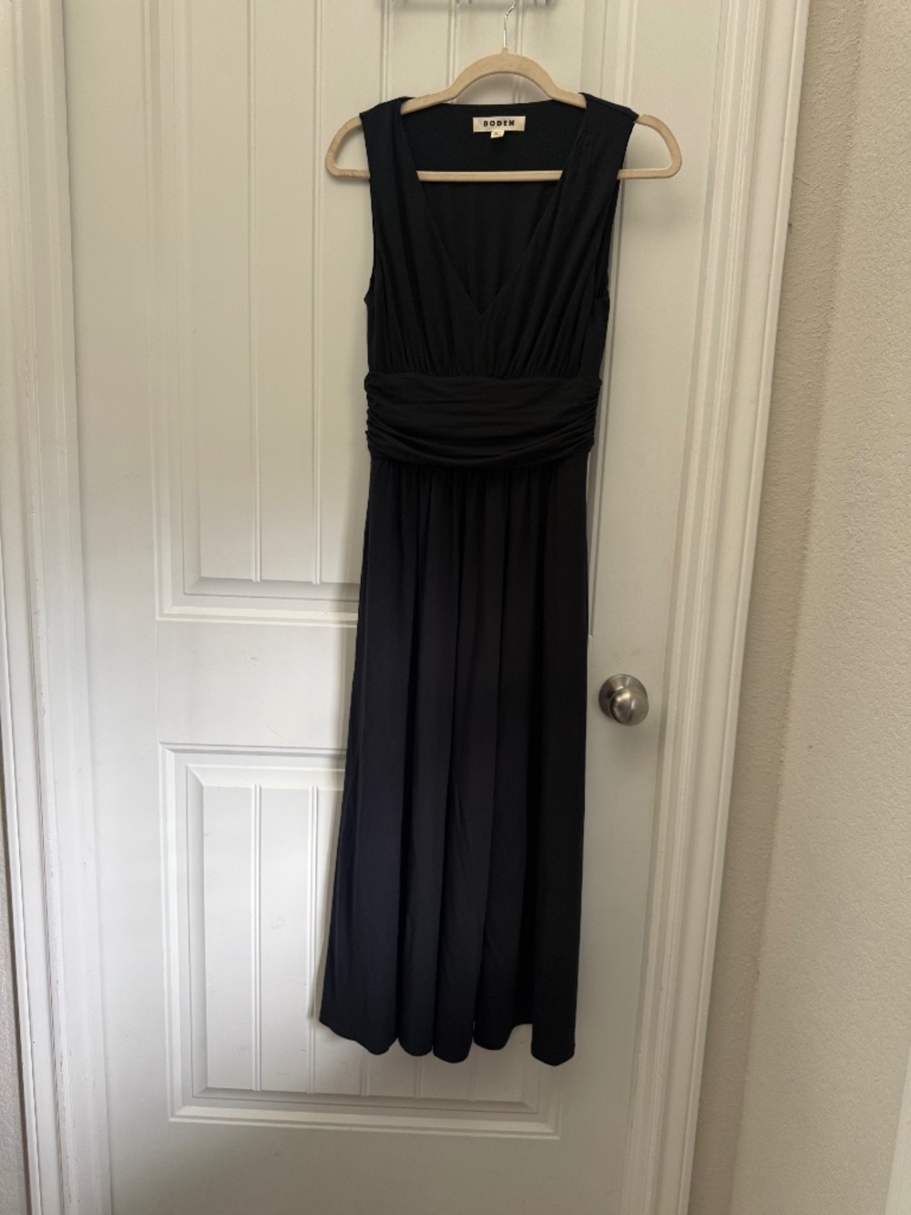 V neck black dress fit and flare with a band separating the top and bottom part